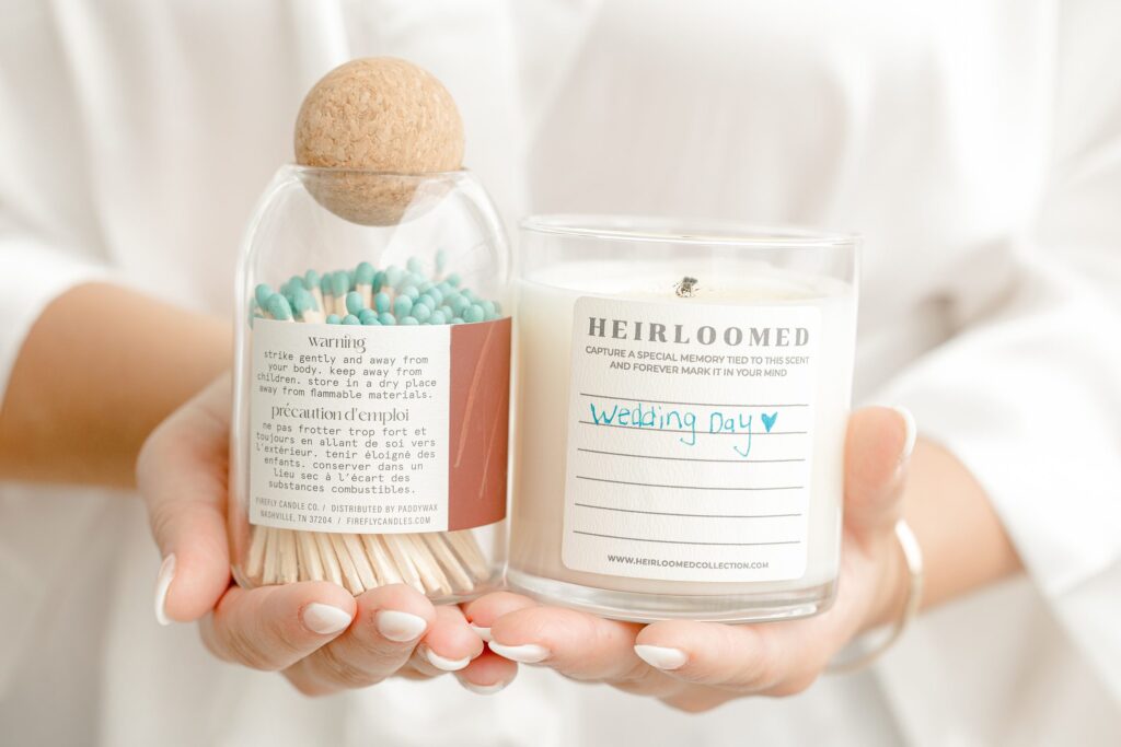 Wedding details including rings, flowers, and invitations at Mackenzie & Russell’s Shelbyville Michigan Bay Pointe Inn wedding