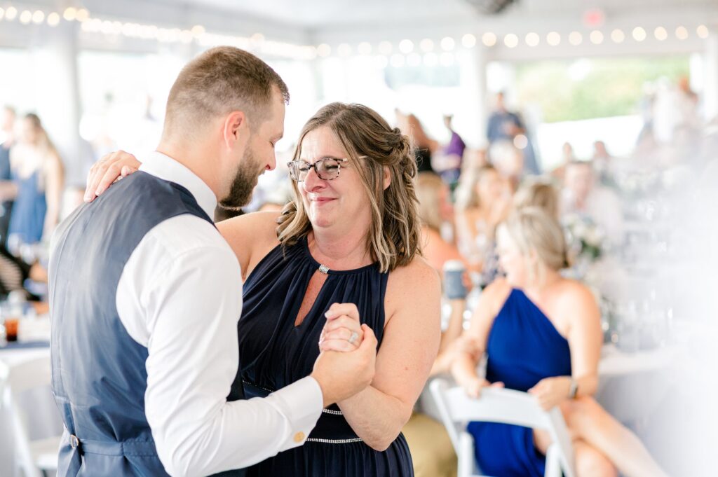 Reception at Bay Pointe Inn for Mackenzie & Russell’s Shelbyville Michigan wedding with summer décor and details
