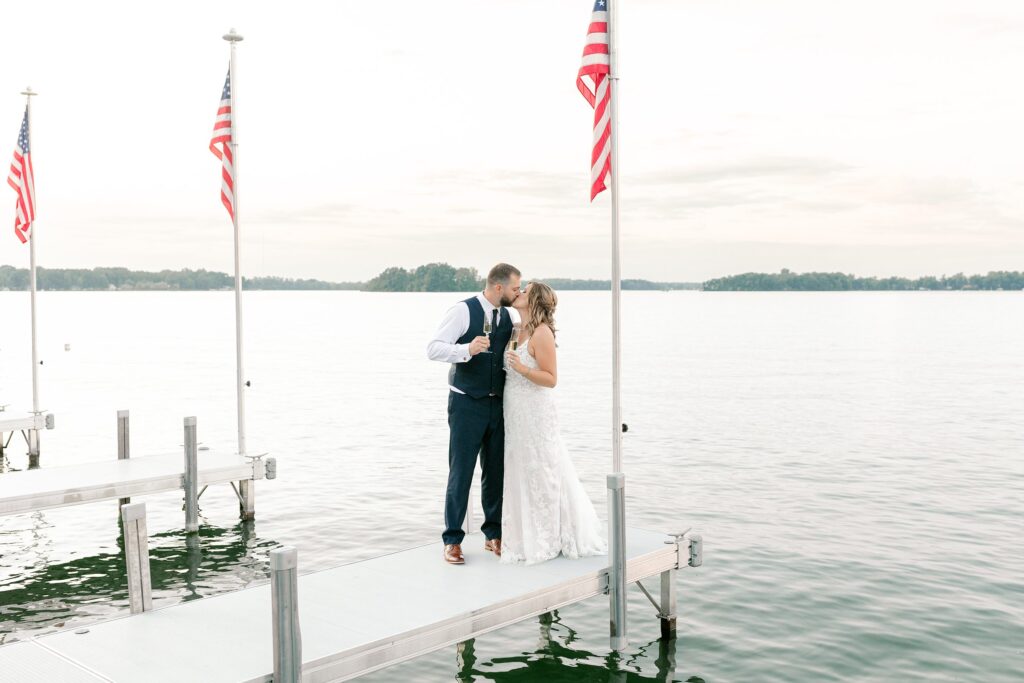 Sunset over Gun Lake during Mackenzie & Russell’s Bay Pointe Inn Shelbyville Michigan wedding