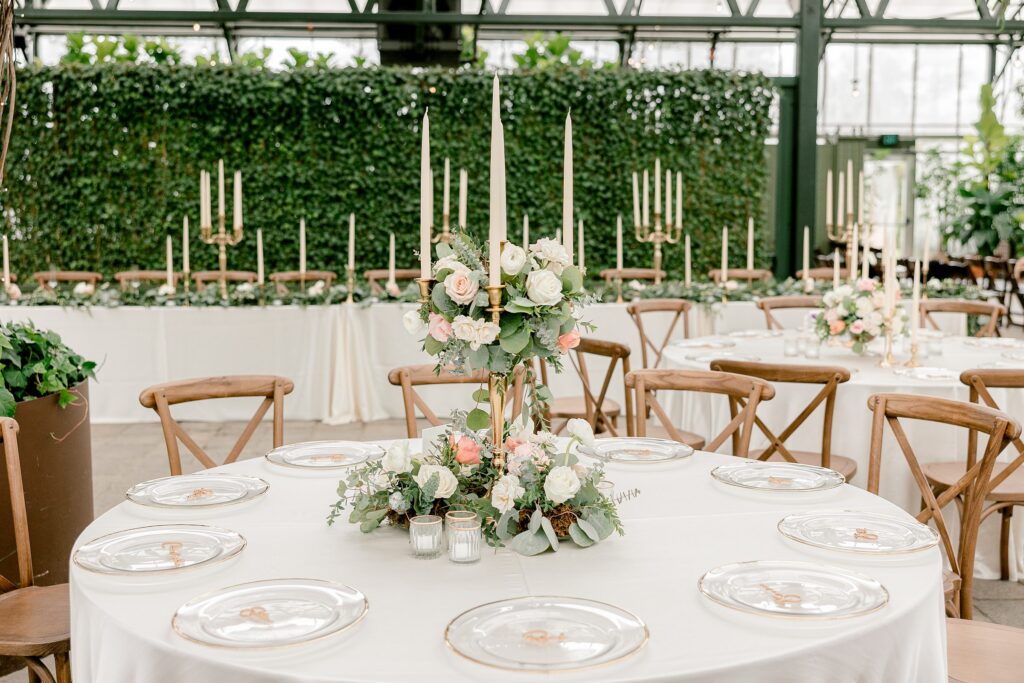 greenhouse wedding reception with candelabra and floral centerpieces
