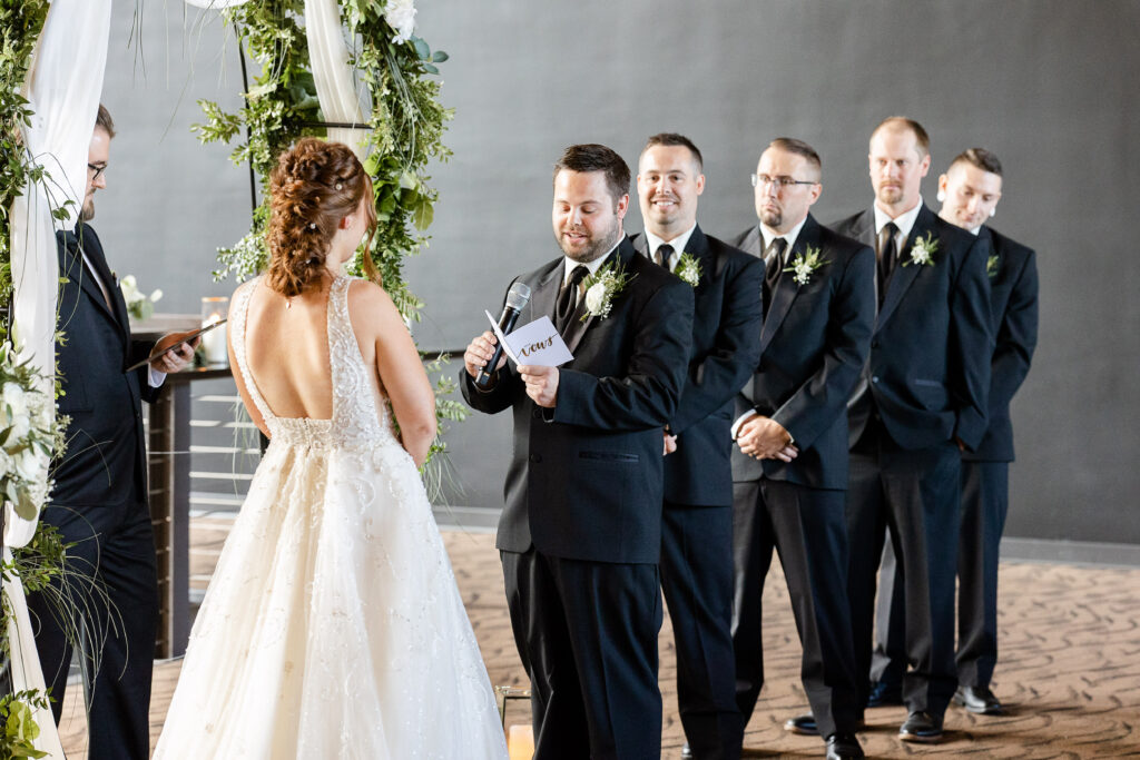Wedding ceremony at New Vintage Place Grand Rapids Michigan wedding photographer Kara Hanes