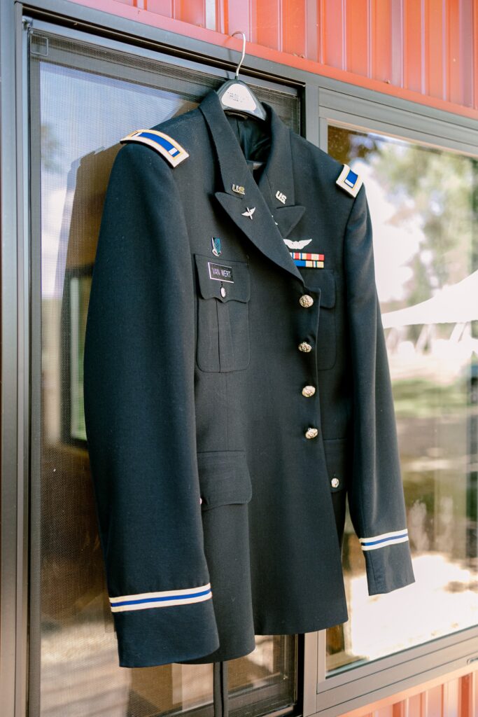 Groom's Army dress uniform hanging in the lodge