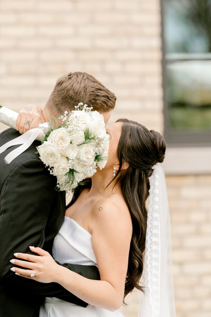 Bride and groom embracing after their first look