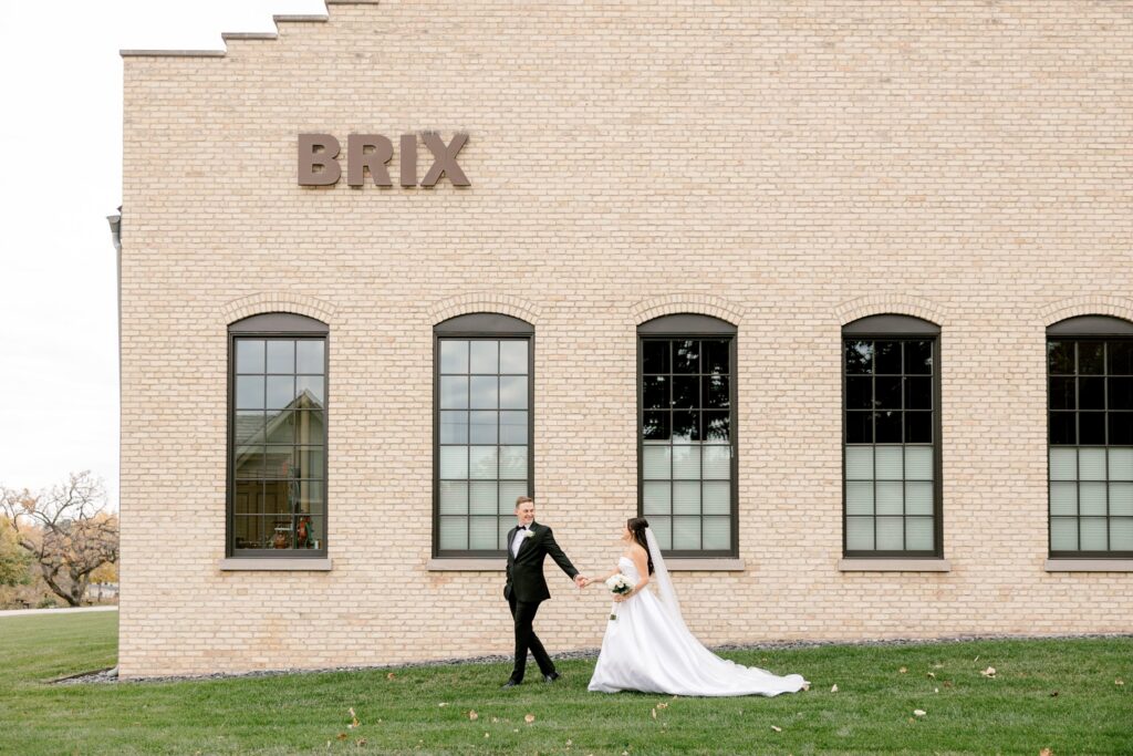 Bride and groom on the lawn outside the historic brick BRIX on the Fox wedding venue near Chicago