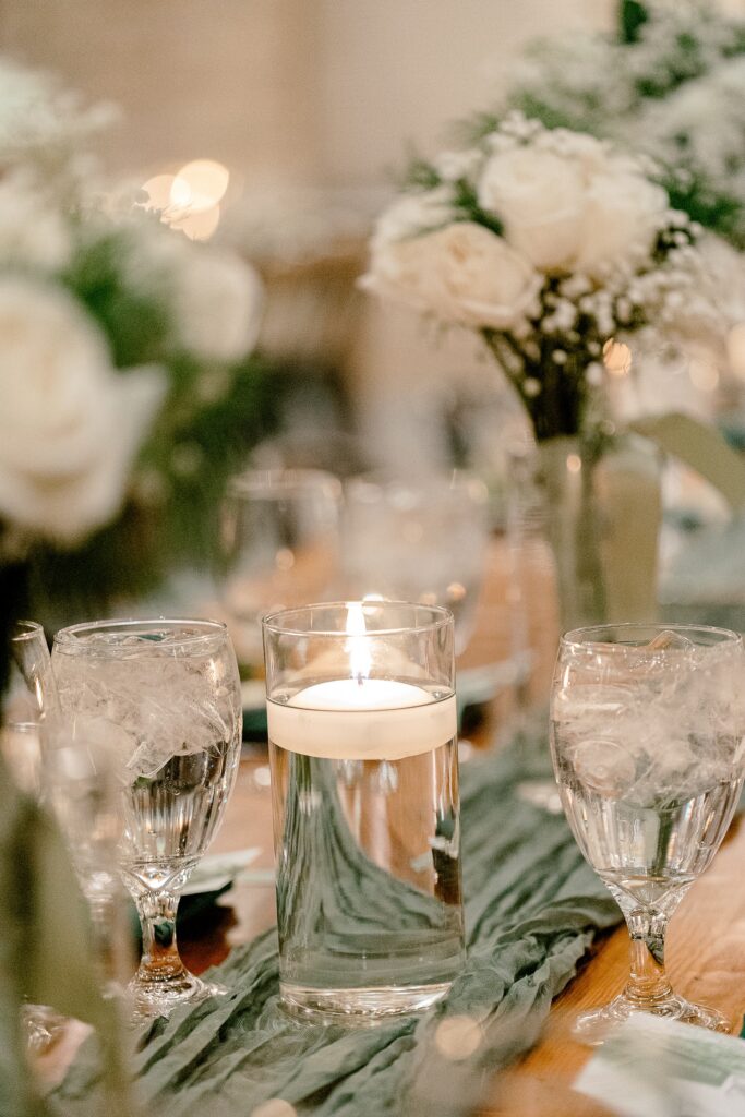 Candlelit reception table with white florals at The BRIX on Fox