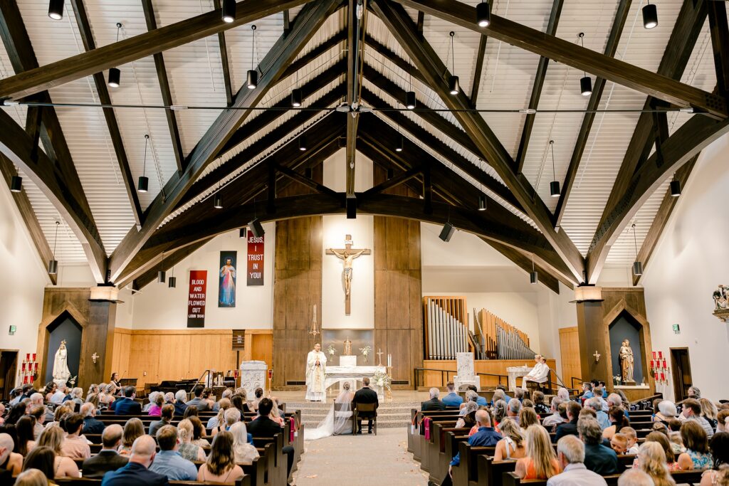 Wide view of the Catholic wedding ceremony at St. John Paul II Catholic Church