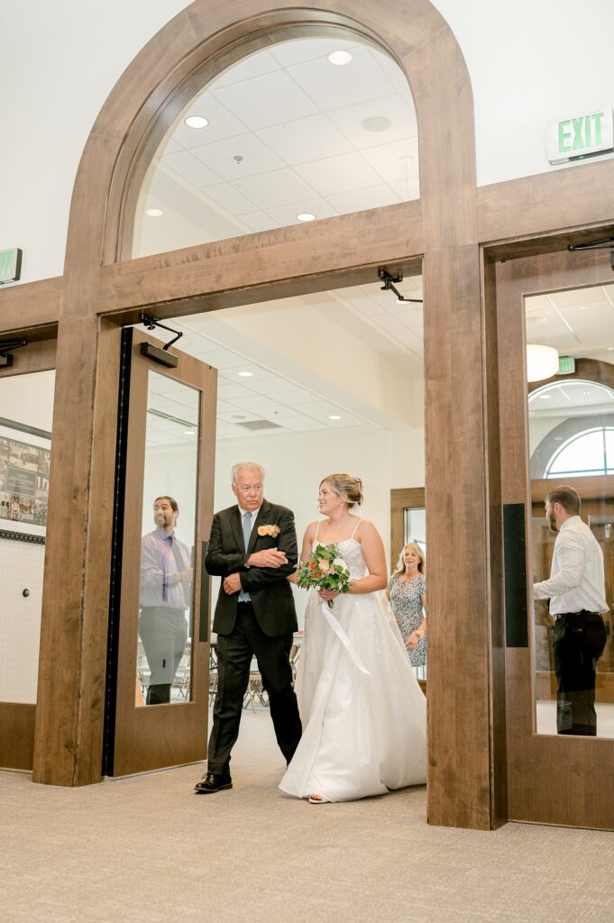 Dad walking the bride through the church doors