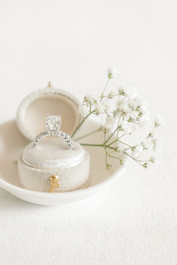 Engagement ring in a ring box with baby's breath