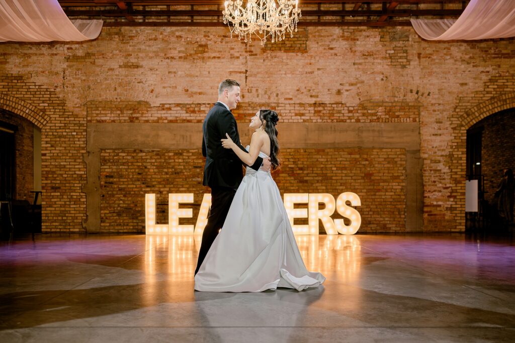 Bride and groom sharing their first dance at the reception