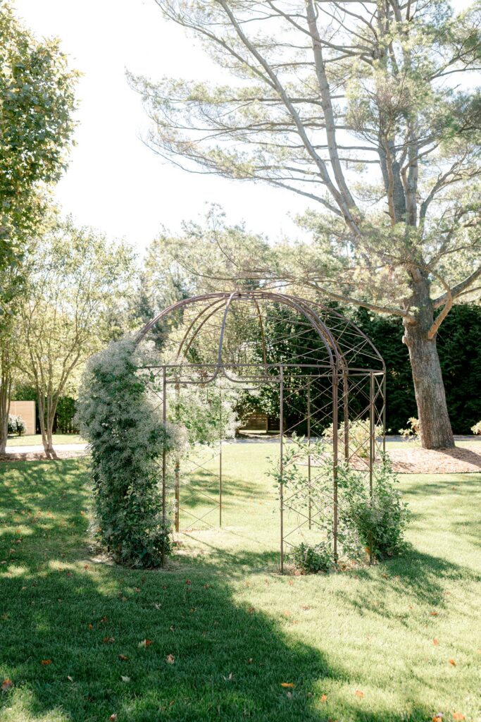 Iron garden arbor on the lawn at Ivy House in Saugatuck
