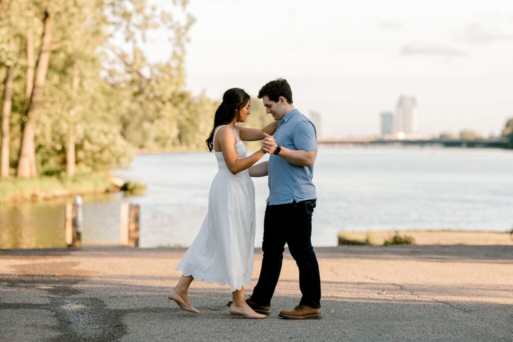 Couple dancing on the path along the Grand River at Riverside Park
