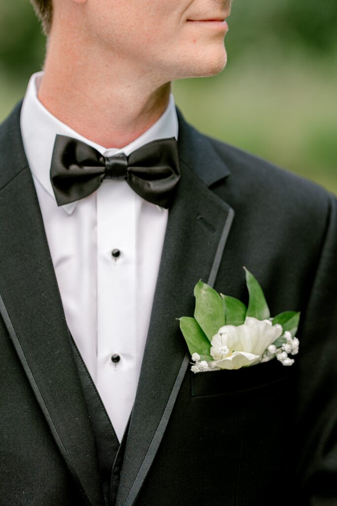 Groom's bow tie and white boutonniere