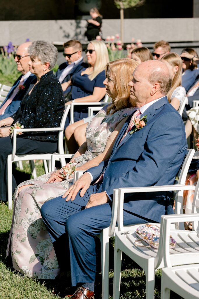 Guests watching the garden ceremony at Frederik Meijer Gardens