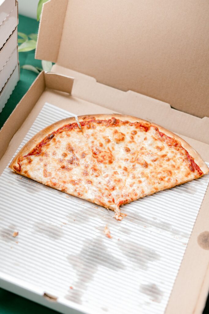 The last slice of Back Alley Pizza in an open box at the end of the night