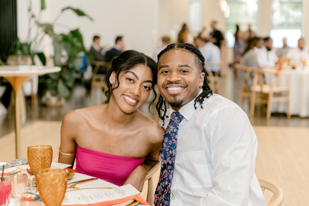 Wedding guests smiling during cocktail hour at Leona Road