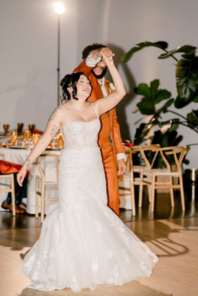 Bride and groom sharing their first dance in the Leona Road reception hall