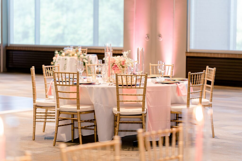 Reception space at Frederik Meijer Gardens with gold chairs and blush lighting