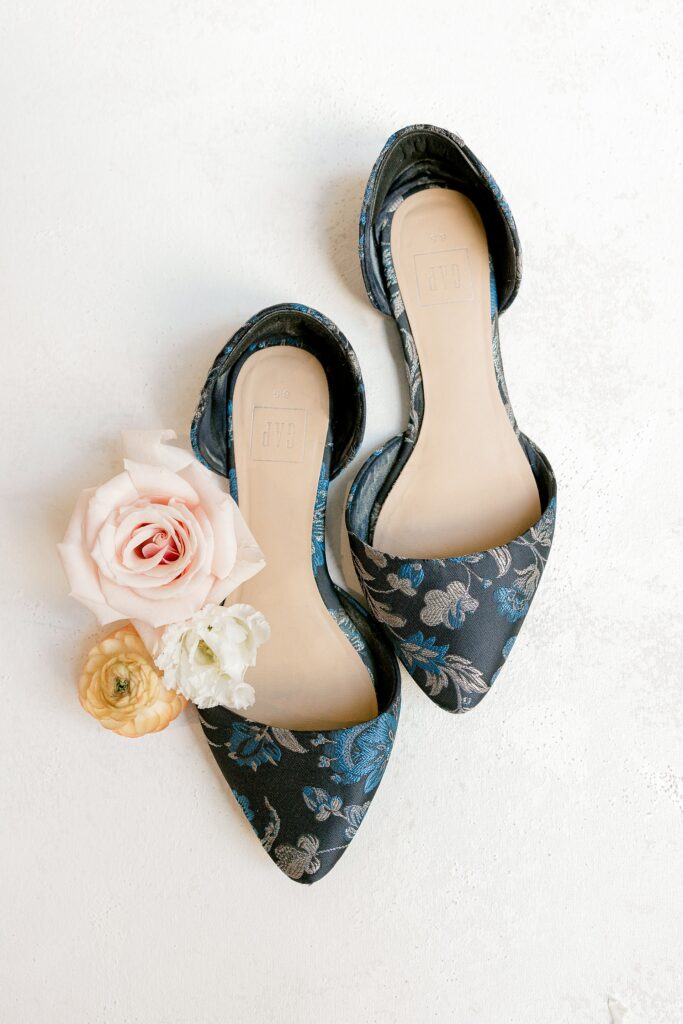 Navy floral bridal shoes with blush roses