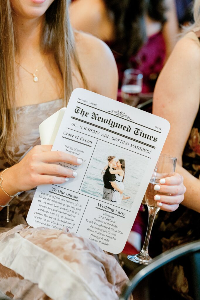 Guest reading a Newlywed Times newspaper wedding program