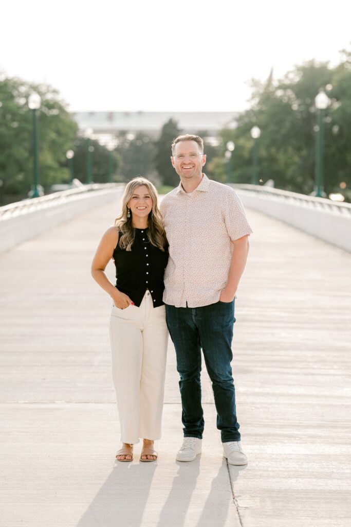 Parents standing close together on the Gillett Bridge in downtown Grand Rapids