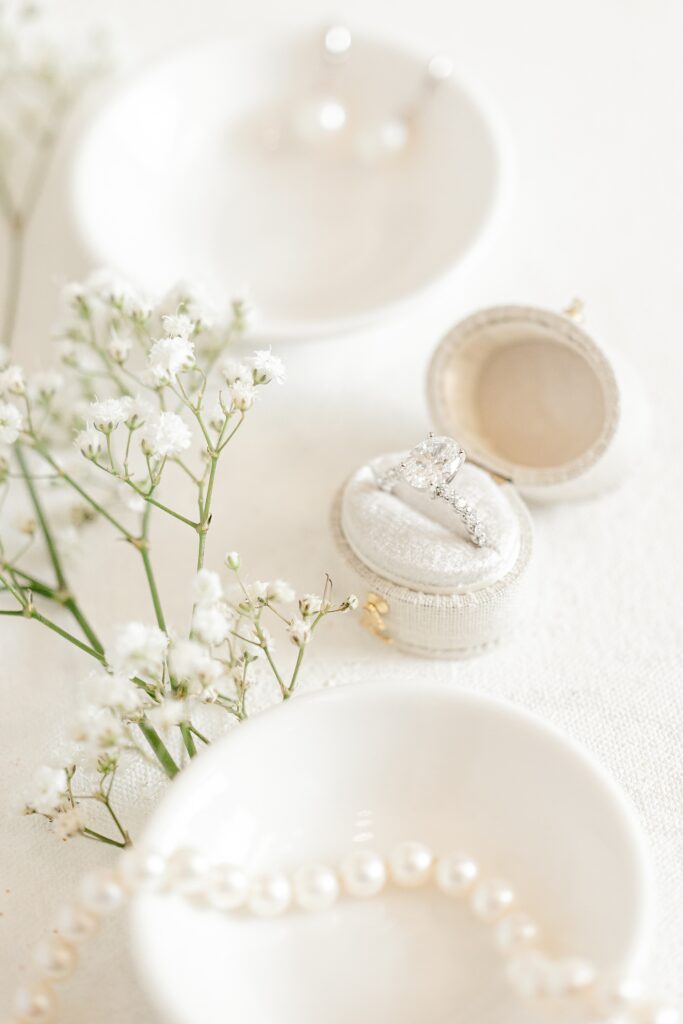 Wedding rings with baby's breath and pearls