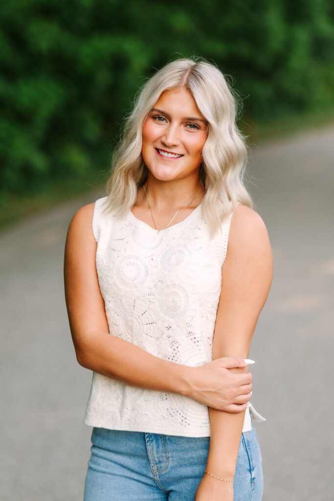 Senior portrait surrounded by greenery at Grand Ravines in Jenison, Michigan