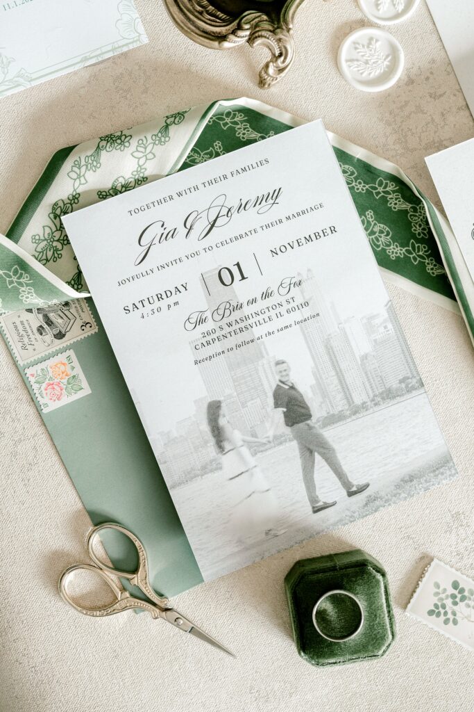 Wedding invitation with a green envelope and photo of the couple